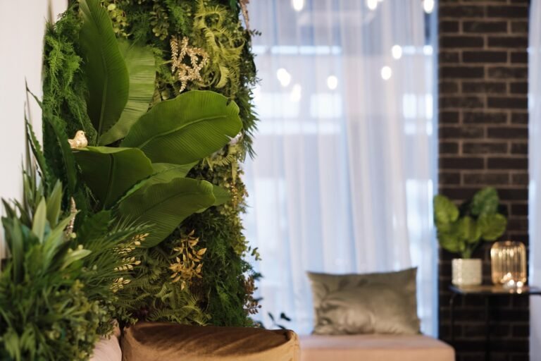 Green plants on the wall in the interior of the room. Vertical green garden in the room